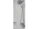 Close-up of an adjustable shower head with a handheld sprayer and white subway tile walls at 5159 Sterling Manor Dr, Tampa, FL 33647