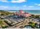 Iconic waterfront hotel with sandy beaches, blue ocean views, ample parking, and vibrant landscaping at 5625 Escondida S Blvd, St Petersburg, FL 33715