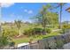 Charming backyard features lush greenery, mulched flower beds, and patio seating at 5625 Escondida S Blvd, St Petersburg, FL 33715