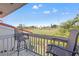 Balcony seating with a view of a lush green golf course with a beautiful blue sky above at 5625 Escondida S Blvd, St Petersburg, FL 33715