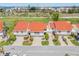 Beautifully landscaped townhomes featuring white exteriors and a red tile roof, nestled in a waterfront golf community at 5625 Escondida S Blvd, St Petersburg, FL 33715