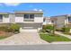 Well-maintained two-story home with a garage and landscaped front yard at 5625 Escondida S Blvd, St Petersburg, FL 33715