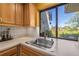 This kitchen sink has a great view out the window to the golf course and offers a lot of counter space at 5625 Escondida S Blvd, St Petersburg, FL 33715