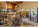 Inviting living room featuring a soaring wood ceiling, comfortable seating, and seamless flow to the dining area at 5625 Escondida S Blvd, St Petersburg, FL 33715