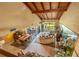 Open-concept living room with vaulted ceilings, skylights, dining area and a large window at 5625 Escondida S Blvd, St Petersburg, FL 33715