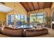 Bright living room featuring comfortable seating, golf course views, and seamless flow to the outdoor space at 5625 Escondida S Blvd, St Petersburg, FL 33715