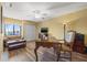 Comfortable office space with desk, sofa, ceiling fan, and closet at 5625 Escondida S Blvd, St Petersburg, FL 33715