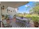 A relaxing outdoor patio overlooking the golf course has a full dining set and built-in grill at 5625 Escondida S Blvd, St Petersburg, FL 33715