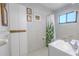 Cozy bathroom with tiled walls, a functional vanity, and ample storage at 5953 36Th N Ave, St Petersburg, FL 33710