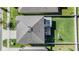 Aerial view of the home, showcasing the roof, backyard, and patio area at 6236 Dutton Dr, Wesley Chapel, FL 33545
