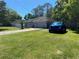 Charming single-story home with a well-manicured lawn and a convenient two-car garage at 6701 Medlar Dr, New Port Richey, FL 34653