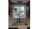 Kitchen sink area with granite countertops, a mosaic backsplash, and a window view at 6701 Medlar Dr, New Port Richey, FL 34653