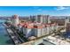 An aerial view of a condo community with a marina, beautiful landscaping, and stunning city views on a bright, sunny day at 700 S Harbour Island Blvd # 240, Tampa, FL 33602