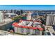 Stunning aerial view of a luxurious building with a red roof, surrounded by water and a cityscape skyline at 700 S Harbour Island Blvd # 240, Tampa, FL 33602