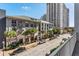 View of a modern apartment building with palm trees lining the street below a clear blue sky at 700 S Harbour Island Blvd # 240, Tampa, FL 33602