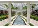 An elegant courtyard featuring a water feature, pergola, and manicured gardens for a serene outdoor experience at 700 S Harbour Island Blvd # 240, Tampa, FL 33602