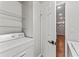 Laundry room featuring a washing machine, metal shelving, and a door at 700 S Harbour Island Blvd # 240, Tampa, FL 33602