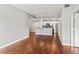 Open concept living room showcasing hardwood floors, a modern kitchen, and ample natural light at 700 S Harbour Island Blvd # 240, Tampa, FL 33602