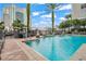 A tranquil pool area featuring a fountain and city views, surrounded by lush greenery and lounge seating at 700 S Harbour Island Blvd # 240, Tampa, FL 33602