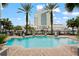 Inviting pool area with comfortable lounge chairs, a calming fountain and lush tropical landscaping at 700 S Harbour Island Blvd # 240, Tampa, FL 33602