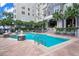Inviting pool area with lounge chairs, manicured landscaping, and clear blue water on a sunny day at 700 S Harbour Island Blvd # 240, Tampa, FL 33602