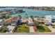 Aerial view of waterfront home with lush landscaping and a private dock at 8032 13Th S Ave, St Petersburg, FL 33707