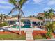 Outdoor living at its finest with a private pool, spa, and covered patio for entertaining guests at 8032 13Th S Ave, St Petersburg, FL 33707