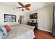 Spacious bedroom features a large television, stylish dresser, and comfortable bedding for a relaxing retreat at 8032 13Th S Ave, St Petersburg, FL 33707