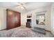 Bedroom with ceiling fan, window with nice natural light, and wardrobe with hardwood doors at 8032 13Th S Ave, St Petersburg, FL 33707
