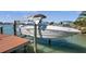 Boat docked with boat lift, offering convenient access to waterways and nautical adventures at 8032 13Th S Ave, St Petersburg, FL 33707