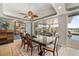 Elegant dining room with tray ceilings, wood furniture, and access to outdoor living space at 8032 13Th S Ave, St Petersburg, FL 33707