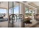 Dining room table with pool and water views through sliding glass doors at 8032 13Th S Ave, St Petersburg, FL 33707