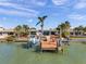 Stunning waterfront home featuring a private boat dock with lift for easy access to open water at 8032 13Th S Ave, St Petersburg, FL 33707
