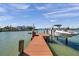 Private boat dock with a boat lift, offering convenient access to waterways and nautical adventures at 8032 13Th S Ave, St Petersburg, FL 33707