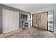 Modern foyer with a custom door, gray accent walls, and unique decor at 8032 13Th S Ave, St Petersburg, FL 33707