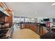 Gourmet kitchen featuring wooden cabinets, stainless steel appliances, and a wine cooler at 8032 13Th S Ave, St Petersburg, FL 33707