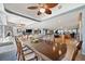 Open floor plan with dining and living areas, featuring a large kitchen island and neutral decor at 8032 13Th S Ave, St Petersburg, FL 33707