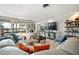 Open living room with plush seating, and sliding doors leading to the pool at 8032 13Th S Ave, St Petersburg, FL 33707