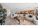 Bright open-concept living room featuring a sectional sofa and decorative rug at 8032 13Th S Ave, St Petersburg, FL 33707