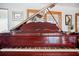 Stunning grand piano with a glossy finish, perfect for music enthusiasts and home decor at 8032 13Th S Ave, St Petersburg, FL 33707