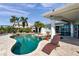 Features a private pool with stone decking, lush landscaping, and a waterfront view, creating an ideal outdoor oasis at 8032 13Th S Ave, St Petersburg, FL 33707