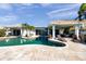 Backyard oasis with an inviting pool, lounge chairs, and lush landscaping at 8032 13Th S Ave, St Petersburg, FL 33707