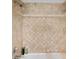 Tile shower featuring multiple shower heads and decorative design at 8032 13Th S Ave, St Petersburg, FL 33707