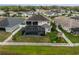Aerial view of the home featuring a screened-in pool, spacious backyard, and playground, set within a well-maintained community at 8141 Carlton Ridge Dr, Land O Lakes, FL 34638