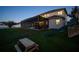 Spacious backyard with a pool, a slide, and artificial grass; perfect for Gathering enjoyment at 8141 Carlton Ridge Dr, Land O Lakes, FL 34638