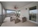 Comfortable outdoor balcony with stylish seating and a ceiling fan, perfect for relaxing and entertaining at 8141 Carlton Ridge Dr, Land O Lakes, FL 34638