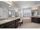 Elegant bathroom with dual vanity, soaking tub, glass shower, and granite countertops at 8141 Carlton Ridge Dr, Land O Lakes, FL 34638