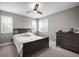 Neutral bedroom with plantation shutters, and a ceiling fan creating a comfortable and inviting space at 8141 Carlton Ridge Dr, Land O Lakes, FL 34638
