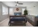 Cozy bedroom with a ceiling fan, plantation shutters, and serene decor creating a peaceful retreat at 8141 Carlton Ridge Dr, Land O Lakes, FL 34638