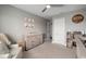 Bedroom with a changing table and soft textures, creating a cozy and inviting space at 8141 Carlton Ridge Dr, Land O Lakes, FL 34638